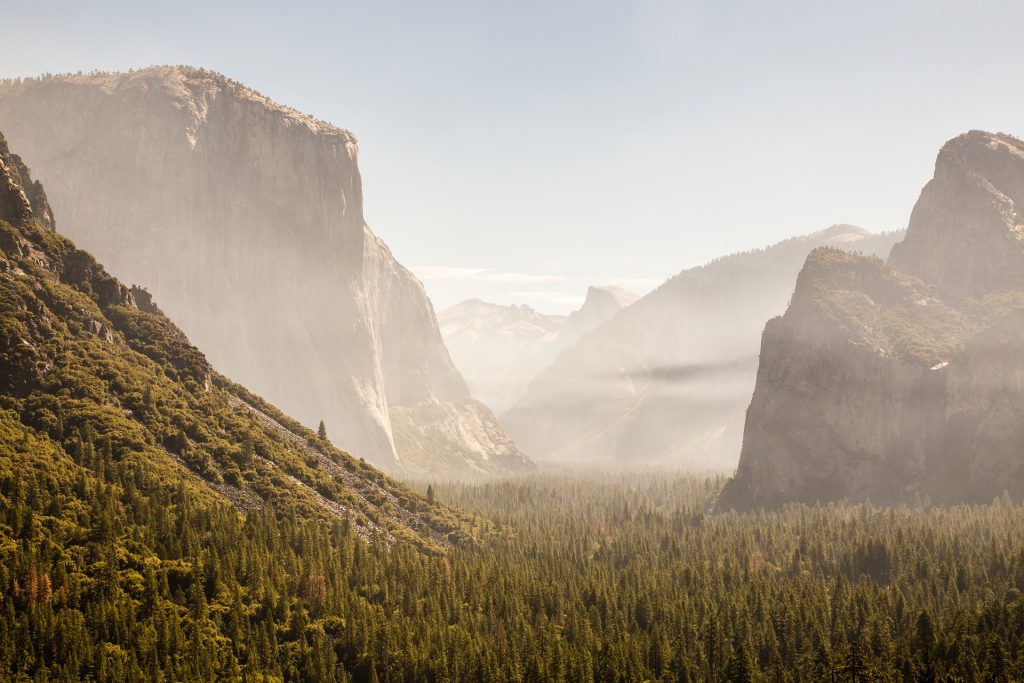 Large boulders and rock formations in Yosemite national Park seen through fog. 