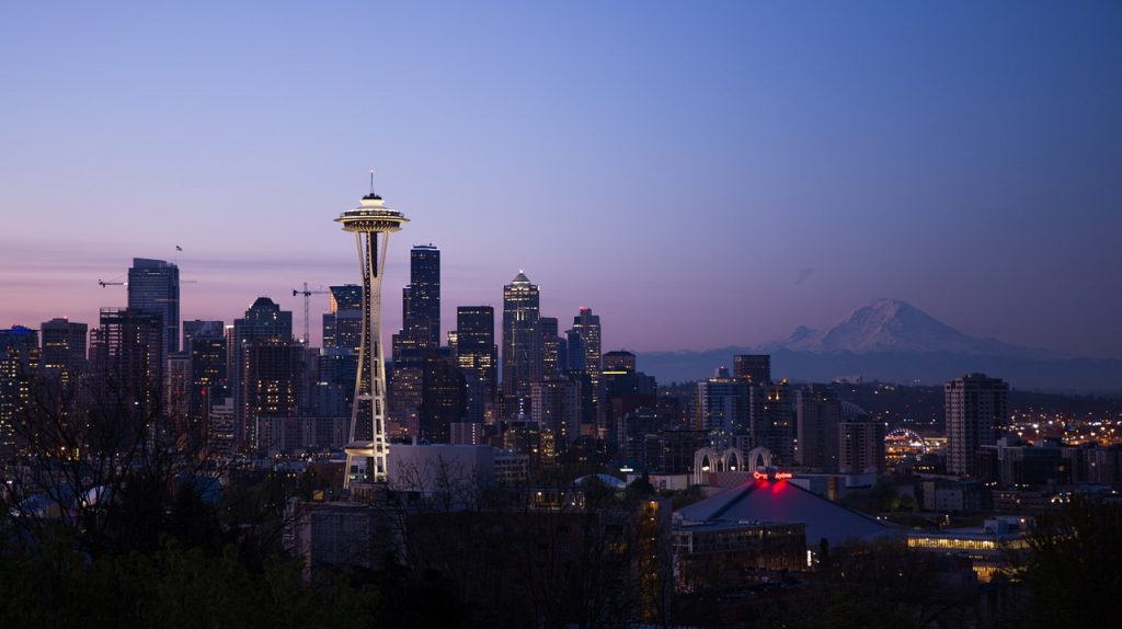 Beautiful sunset and Mount Rainier National Park make the perfect backdrop for the skyline of Seattle, Washington.
