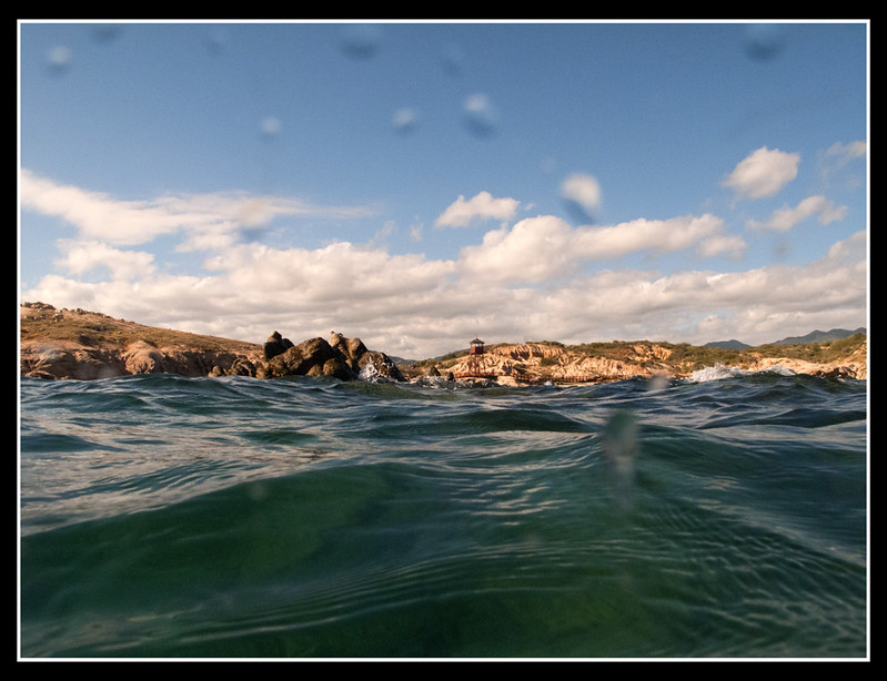 Shore of Cabo Pulmo National Park seen from right above the surface of the ocean. Cabo Pulmo Marine Park is a diver's paradise near Cabo San Lucas.