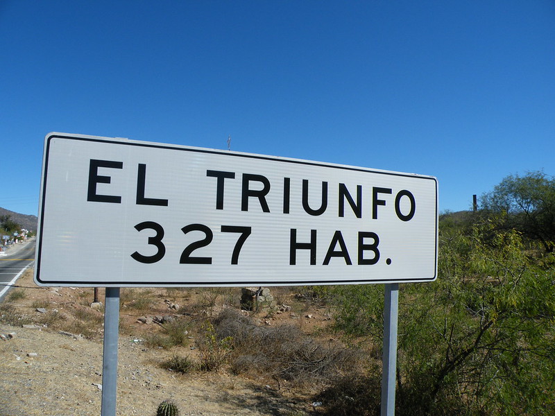 Photo of El triunfo mining town sign, stating the city only has 327 inhabitants as of 2010. El triumfo is a great under the radar destination near La Paz, Baja California, Mexico.