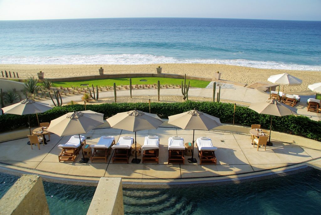 Scenic beach resort in Cabo. Chilling at a sandy beach is one of the best things to do in Cabo San Lucas.