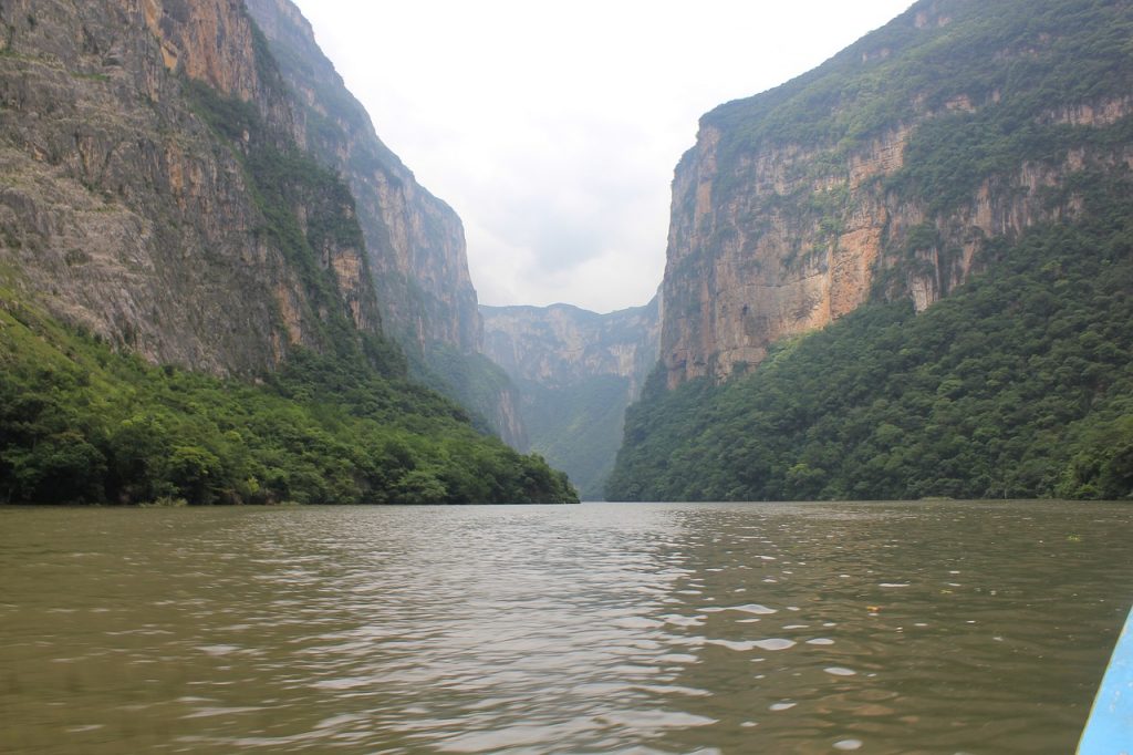 Sumidero Canyon seen from the river on a cloudy day in Chiapas, Mexico. Sumidero Canyon is one of the best attractions to see near San Cristobal de Las Casas