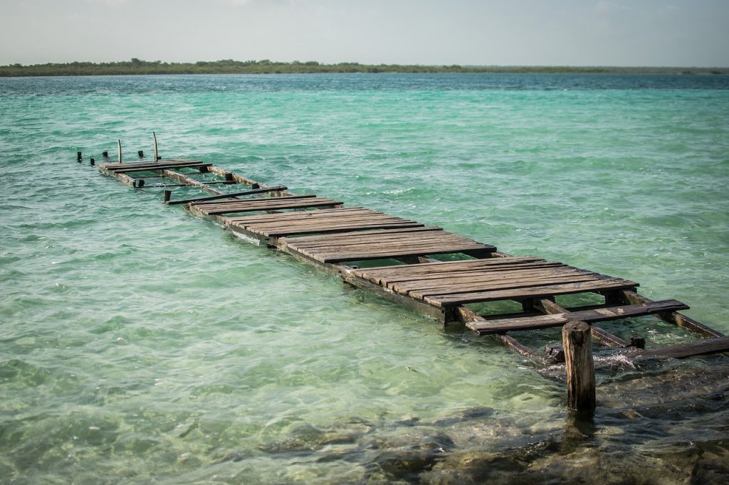 Lake Bacalar is a beautiful lagoon in souther Mexico, and a great place to see on a Mexico road trip around the Yucatan peninsula.