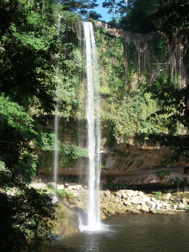 water flowing down at the misol-ha waterfalls in chiapas mexico, near palenque archeological site.