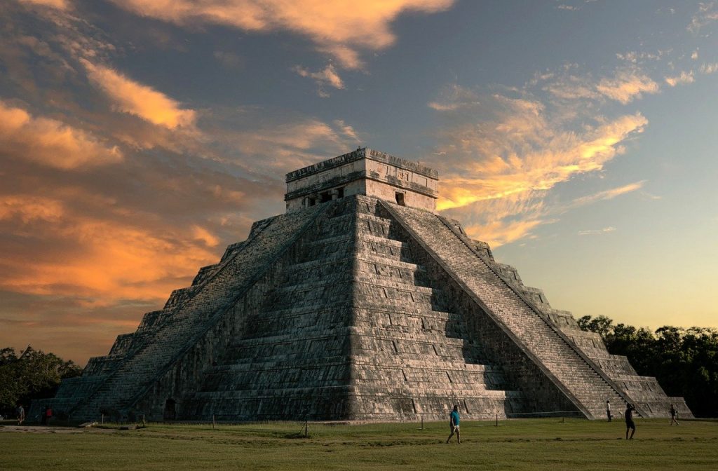 beautiful picture of chichen itza mayan pyramid during sunset, on a sunny day in Mexico. Chichen Itza is an absolute must see when visiting Mexico.