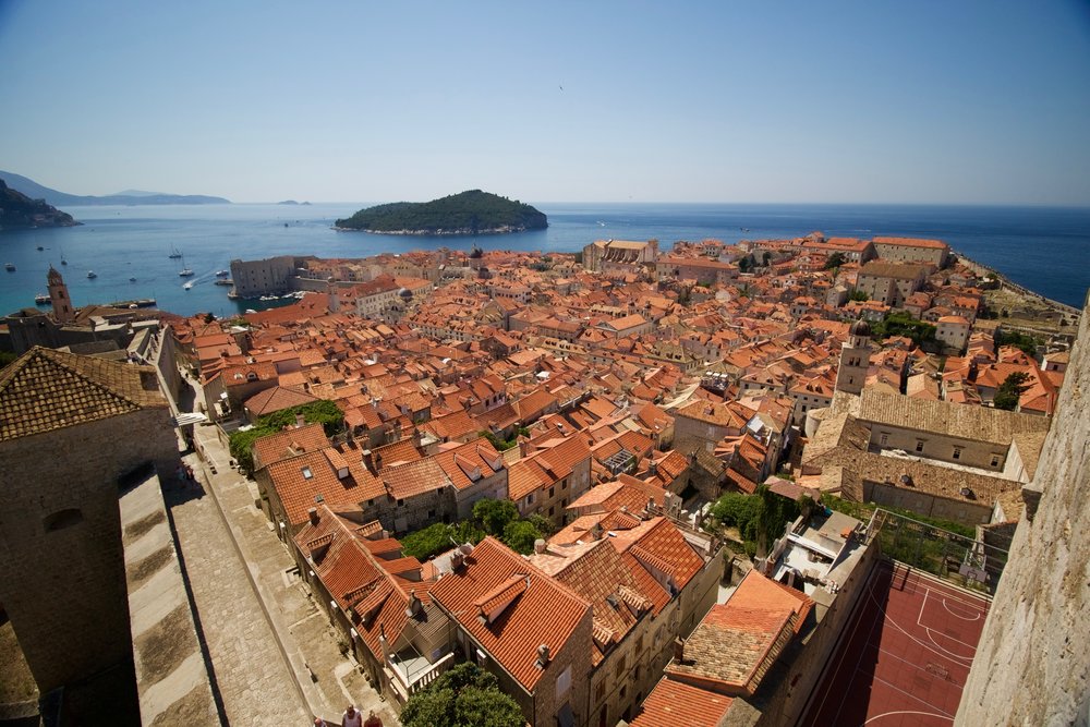 Old town of Dubrovnik seen from an elevated view point. Wonderful red roofs of traditional buildings near the Adriatic sea. Dubrovnik is a great destination to visit on a Balkan road trip