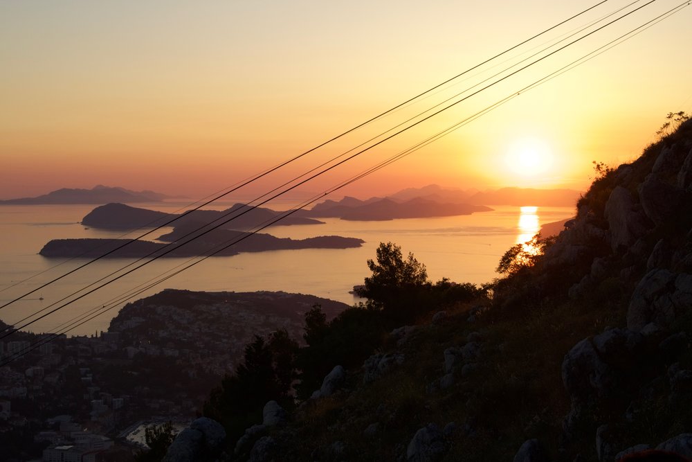 Panoramic view of Dubrovnik and its surrounding hillside area can best be seen from a cable car ride up the Sra hill. Sunset view of the Balkans