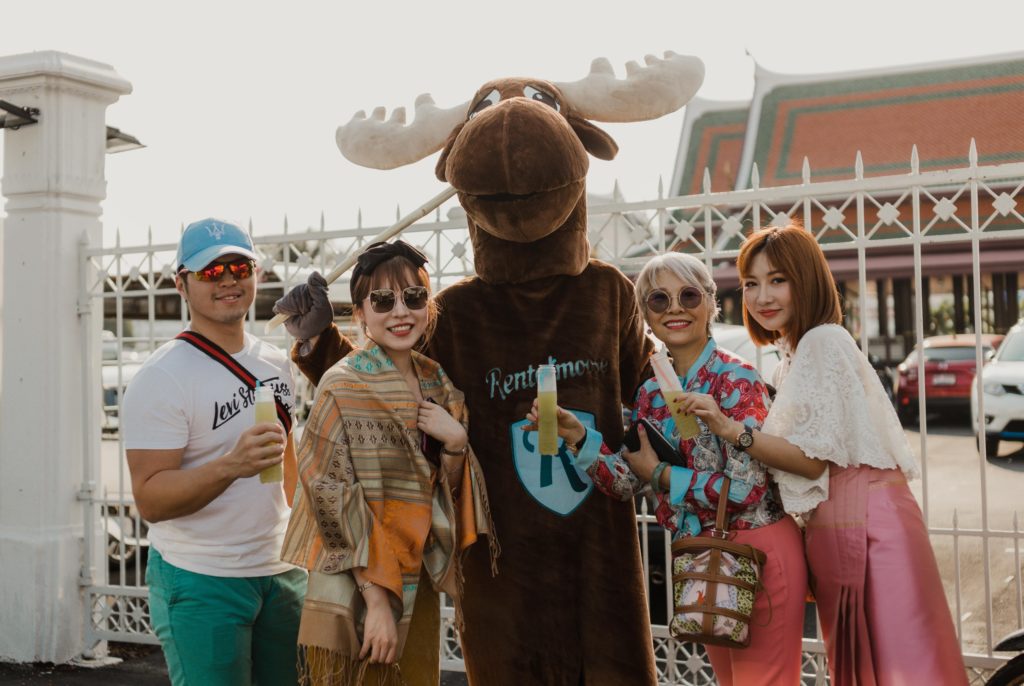 Rental Moose mascot posing with tourists in the heart of Bangkok. 