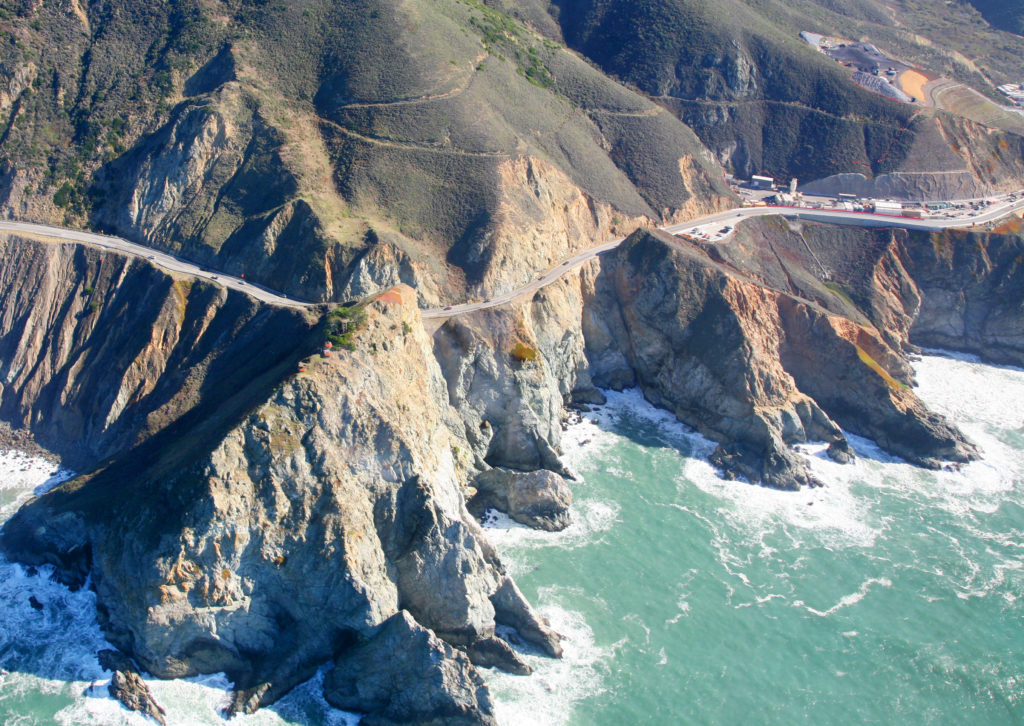 Devil's Slide is a former part of the Pacific Coast Highway. It has been turned into a paved path for cyclists and hikers. Aerial view of Devil's Slide.